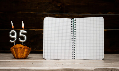 Birthday with number  95, copy space. Anniversary background Creative postcard congratulation with an open notepad with a blank sheet. Festive background with a frame for text.