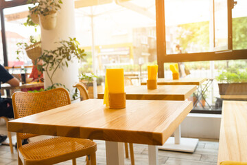 wood table on blur of cafe, coffee shop, bar, background - can used for display or montage your products. High quality photo