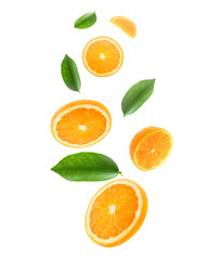 Falling juicy oranges with green leaves isolated on transparent background. Flying defocusing slices of oranges. Applicable for fruit juice advertising. transparent background