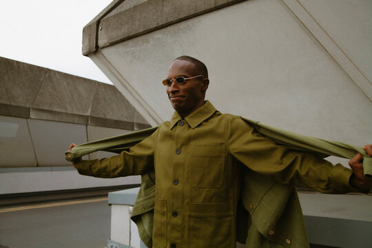 Fashion portrait of trendy autistic black guy wearing sunglasses