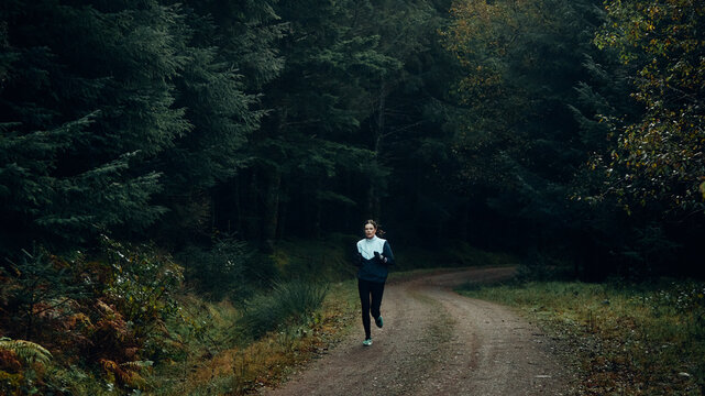 woman running in the forest