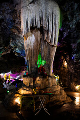 Deity of death or Prince devils statue in underworld hell at Stalagmites stalactites pole thai...