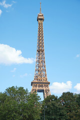 Fototapeta na wymiar Eiffel tower in Paris during a sunny day . Travel landmarks in Europe and France .