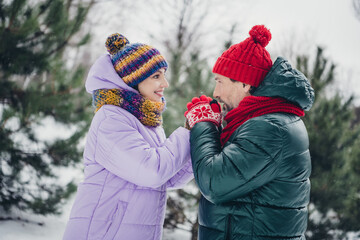 Photo of adorable positive wife husband dressed coats feeling cold warming arms outdoors urban forest park - obrazy, fototapety, plakaty
