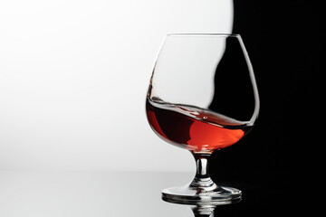 Splash of brandy in a snifter glass.