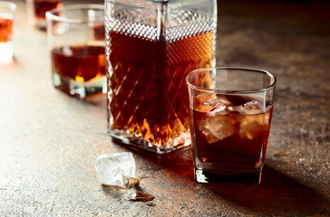 Whiskey in frosted glass with ice.