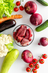 Meat beef stew - raw meat with vegetables for cooking, top view