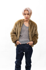 winter faux fur coat. Fashion portrait Asian young man. model, clothing and cosmetics. Young male...