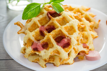 cooked fried potato waffles with sausage stuffing inside