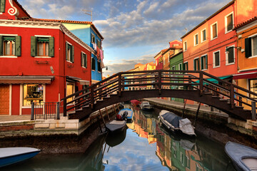 Fototapeta na wymiar Colorful houses and canal on Burano island, near Venice, Italy.