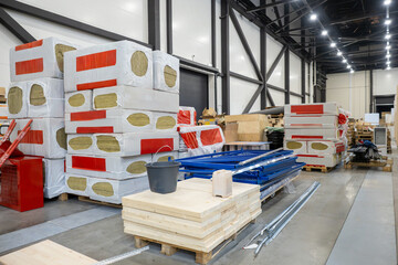 Production of insulation. Material for room energy efficiency. Warehouse building with insulation...