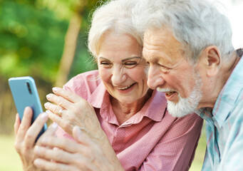 woman man senior couple together elderly smartphone online communication cellphone mobile phone...