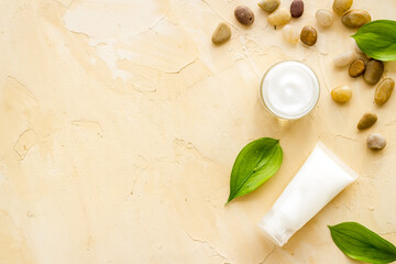 Obraz na płótnie Canvas Layout of cosmetic moisturizer face skin cream in glass vial, top view