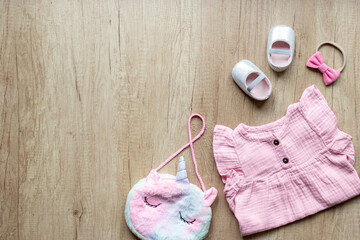 Obraz na płótnie Canvas Set of baby girl dress and accessories, top view. Kids wear flat lay
