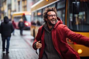 A happy man is stopping a bus on a city street - Powered by Adobe