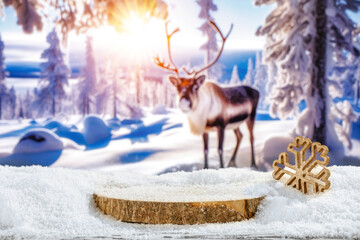 Table covered with snow and frost, place for your product, wooden podium and Christmas decoration, blurry natural background of forest landscape and reindeer, Christmas magical december  time,  - obrazy, fototapety, plakaty