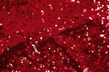 glittering background of red sequins closeup. Sparkle festive texture