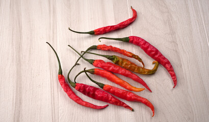 Fresh long Indian green and red chillies on beautiful background. Organic Indian spices for hot and...