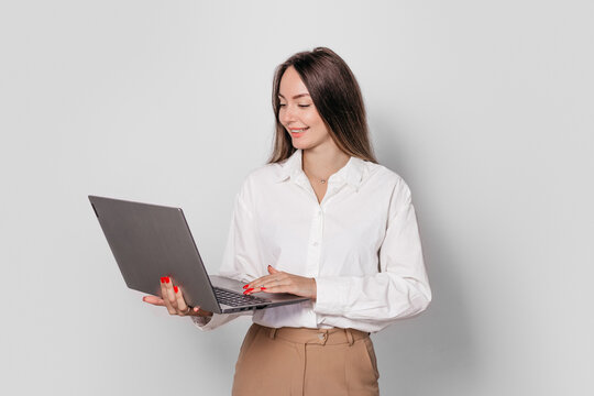 business woman with a laptop isolated on a white background