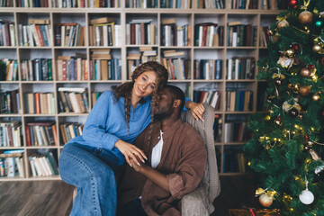 affectionate African-American couple celebrating winter holidays