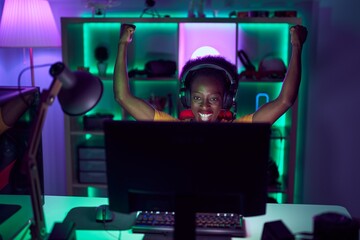 African american woman streamer using computer with winner expression at gaming room © Krakenimages.com