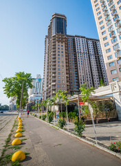 High-rise building on a sunny summer day, modern high-rise development, skyscraper