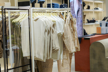 Women's clothes in a store on a hanger, sweater, pullover, sleeveless vest, etc.