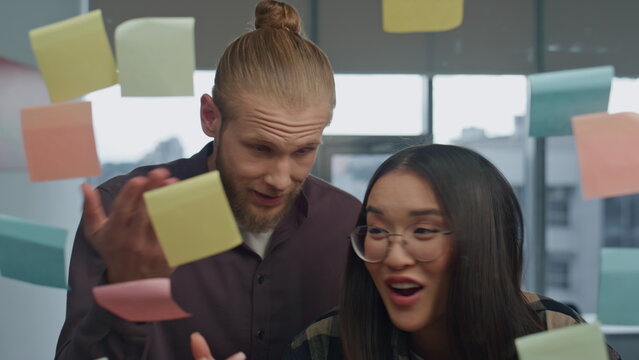 Emotional couple arguing in transparent wall close up. Stressed girl explaining - Powered by Adobe