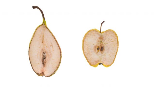 4K Time Lapse of half of fresh pear and aplle quickly dried out, isolated on white background. Dries out and shrinks fruits timelapse.