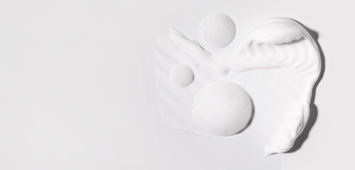 texture foam mousse foam cosmetic smear sample on a light background