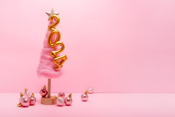 Isolated bright pink background fluffy creative Christmas tree made of wool, golden numbers 2024...