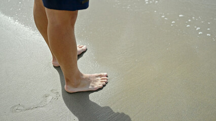 Young man tourist standing at the beach