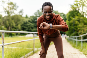Black woman, fitness or smart watch for pulse check in nature workout, training or sunset exercise...