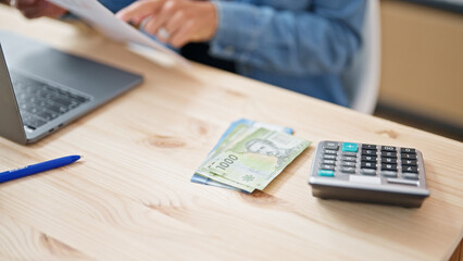 Young beautiful hispanic woman business worker counting chilean pesos at office