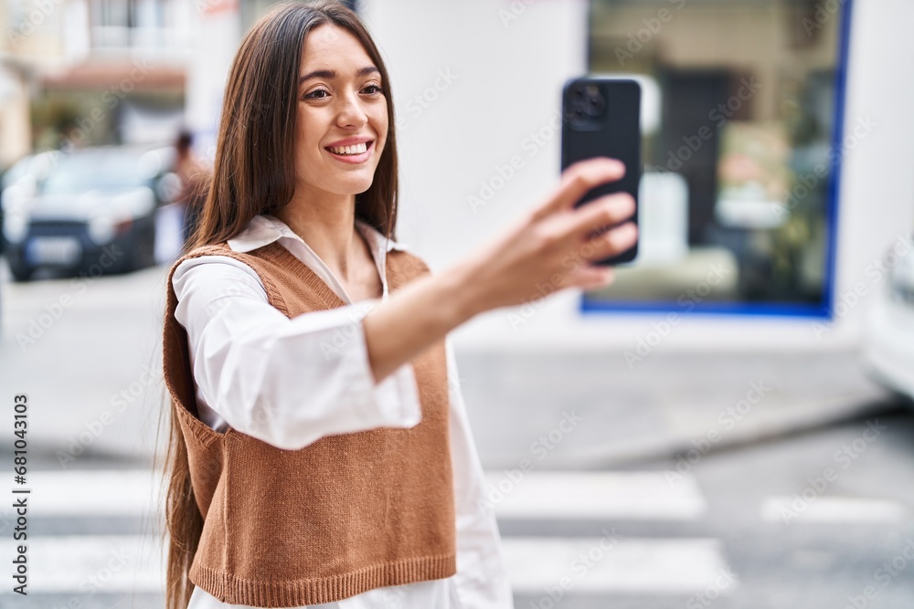Canvas Prints Young beautiful hispanic woman smiling confident making selfie by the smartphone at street - Canvas Prints