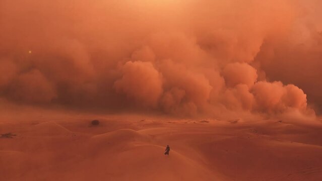 Arab woman in traditional abaya dress walking in a desert. Epic and Huge sandstorm coming.