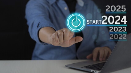 Businessman touching to choose year 2024 for starting preparing Merry Christmas and Happy New Year. Business planning concepts. Start up