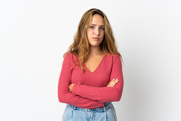 Young blonde woman isolated on blue background feeling upset