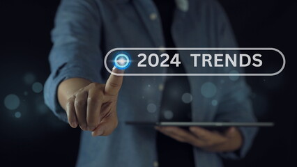 Businessman touches to choose the best trends for 2024 to start preparing for Merry Christmas and Happy New Year. business planning ideas