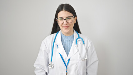 Young hispanic woman doctor smiling confident standing over isolated white background