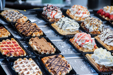 Waffles and Waffle, typical pastries of Brussels Belgium, sold in many shops in capitol of Europe