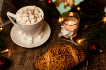 Croissant and marshmallow on the New Year's table. Romantic Family Evening