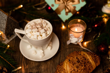 Croissant and marshmallow on the New Year's table. Romantic Family Evening