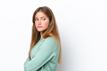Fototapeta premium Young caucasian woman isolated on white background keeping the arms crossed