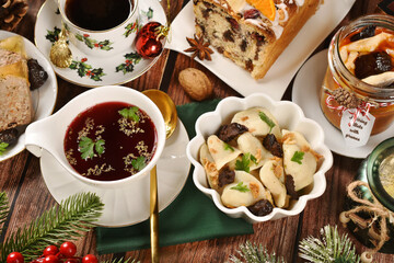 Top view on Christmas table with red borscht with dumplings and other dishes
