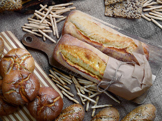 Rye buns, buns with sunflower seeds and linseed, grissini with sesame seeds and low fodmap crusty ...