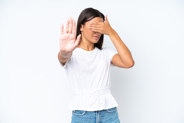 Young caucasian woman isolated on white background making stop gesture and covering face