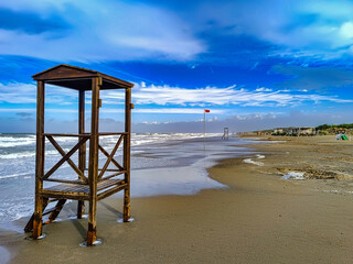 In the foreground lifeguard station used in summer on the beach of Marina di Castagneto Carducci Livorno Tuscany Italy