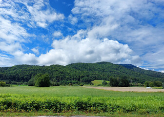 Fototapeta na wymiar fluffy white clouds over Mariborsko Pohorje. Summer day. Slovenia. Europe