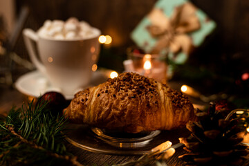 Croissant and marshmallow on the New Year's table. Romantic Family Evening